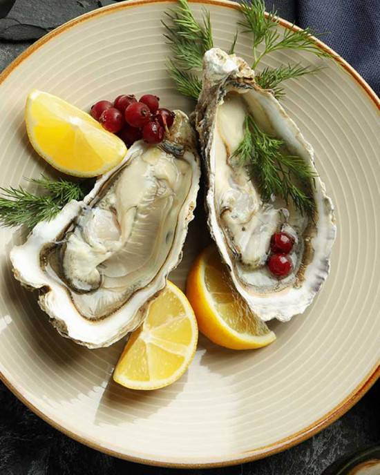 Japanese Oysters Shape In Plate With Lemon Bivalve