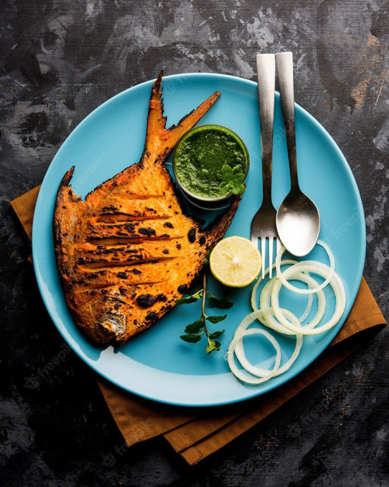 Tandoori Pomfret Cooked & Garnished With Lemon
